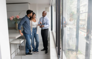 real estate agent with clients